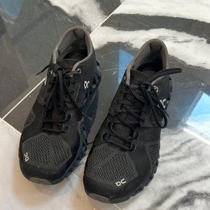 All black On Running sneakers